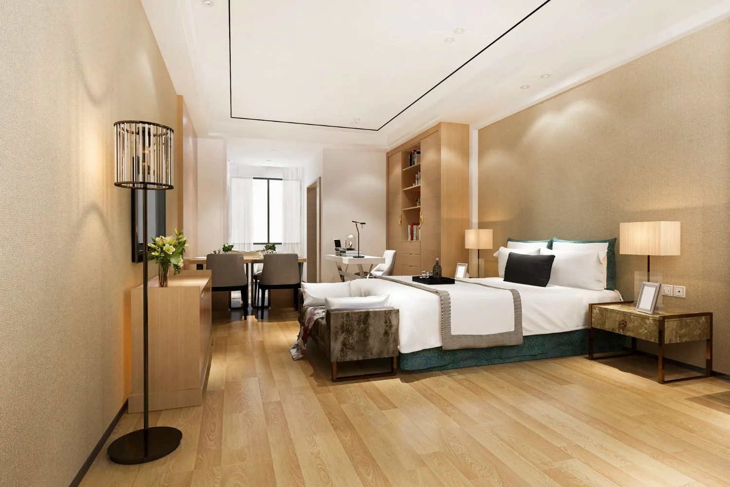 Elegant hotel room with a large bed, bedside tables, a work desk, a seating area, and modern decor.